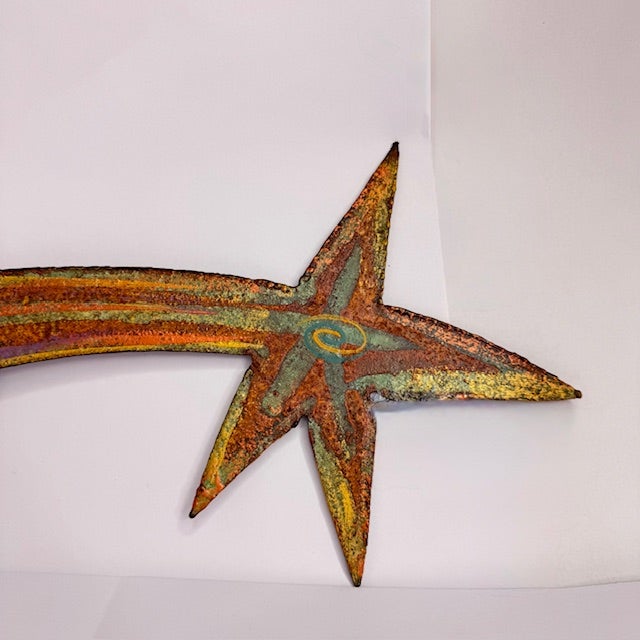 Add a striking sculptural element to your space with this signed metal shooting star wall sculpture by Todd Shields....