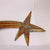 Add a striking sculptural element to your space with this signed metal shooting star wall sculpture by Todd Shields....