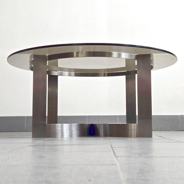 Good overall condition. Numerous scratches on the smoked glass top. The top rim of the frame is slightly deformed in one...