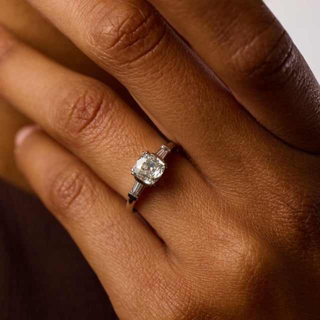 This elegant Mid Century engagement ring centers on a 1.02 carat old mine cut diamond, certified by GIA #1535678347,...