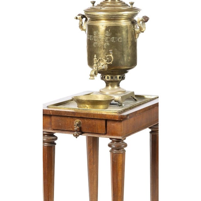 Samobar with tray, bowl, and table. Russian; early 20th century, made of gilded metal; cylindrical body with a square...