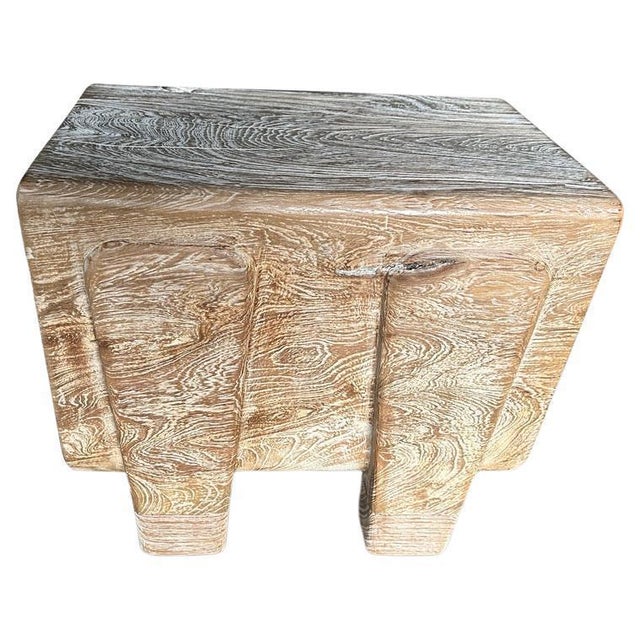 Impressive twelve inch thick log floats five inches off the floor on minimalist cut out legs. We added a cerused finish...