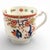 An early 19th-century Worcester porcelain tea cup and saucer by Flight, Barr & Barr, decorated in the celebrated “Two...