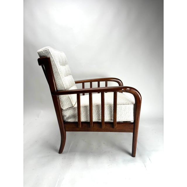 This magnificent pair of 1950s armchairs embodies the elegance of midcentury Italian design, paying homage to the...