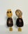Gorgeous pair of artisan carved owl figurines mountedd on brass bases as lamp finials.