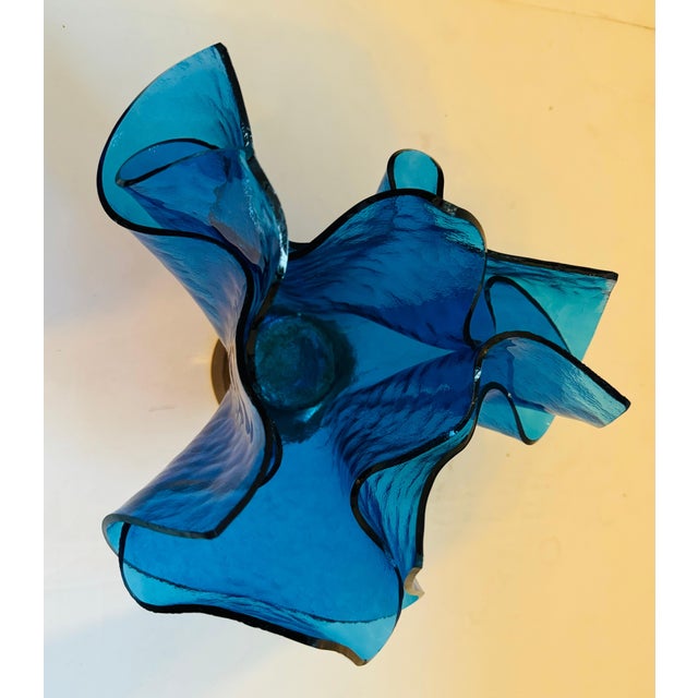 A beautiful 1980s Post Modern blue glass sculptural vase on a bronze vase made by famed Italian designer, Esa Fedrigolli....