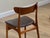 Elevate your dining space with this exquisite set of six authentic Danish Mid-Century Modern dining chairs, designed by...