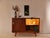 An original vintage sideboard from the 1960s in a timeless mid-century design. Particularly striking are the harmoniously...