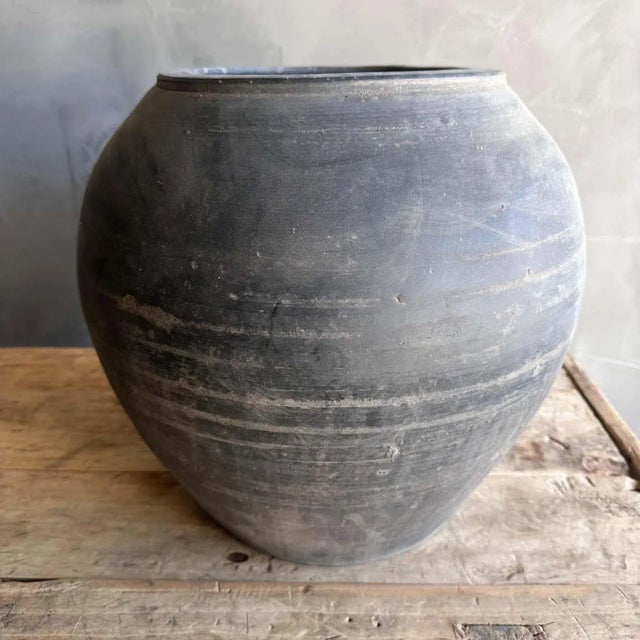 Discover the charm of vintage matte oil pottery, showcasing stunning gray hues and unique imperfections that add character...