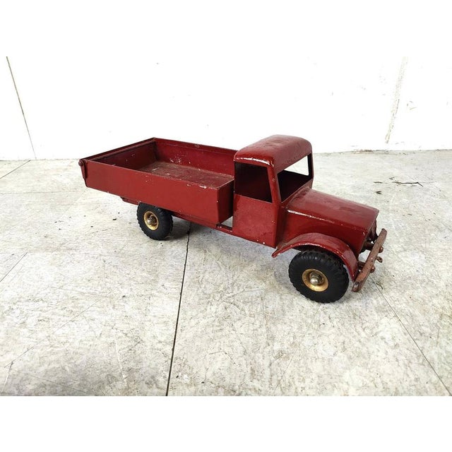 Vintage toy car from the english brand 'Tri-ang'. The charm is in the wear and tear of this item, it makes this little...