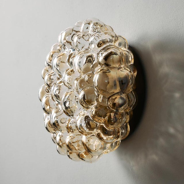Bubble glass wall light from the 1960s designed by Helena Tynell for Limburg.The lamp has some surface scratches and...