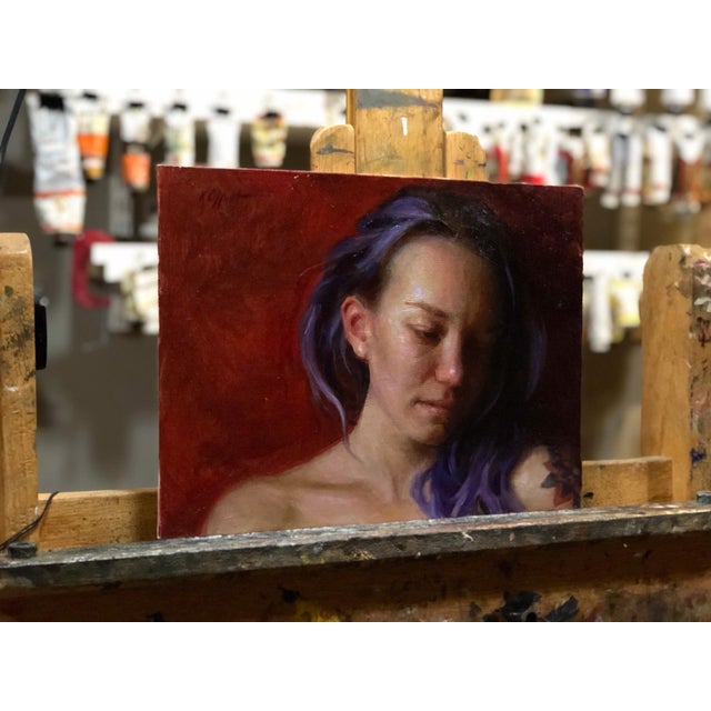 This oil on panel portrays a contemplative figure with soft, flowing hair, rendered against a rich, warm background. The...