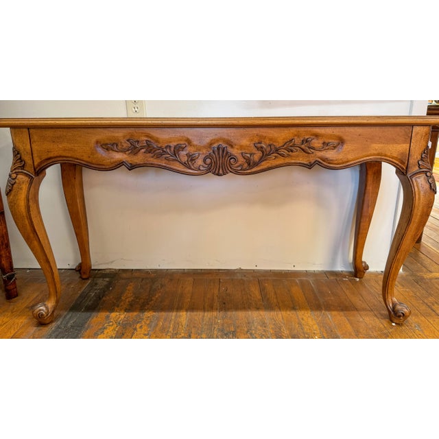 This stunning vintage console table embodies the timeless elegance of French Provincial and French Country design. Crafted...