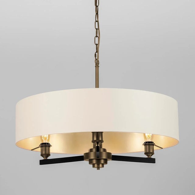 A Chandelier Which Is Transitional In Design Featuring Reeded Columns And Knurled Lampholder Covers. Shown Here With An...