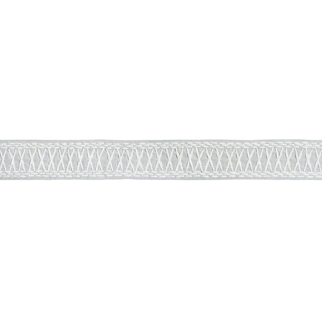 Created in collaboration with Mary McDonald, Tikki Tape is a substantial trim with a graphic crisscross pattern...