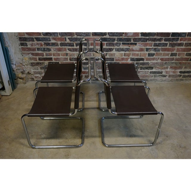 Set of 4 mid century Knoll Marcel Breuer Chrome and Leather Chairs. The chairs have the original, worn, leather seats....