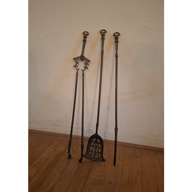 Vintage solid brass fireplace tool set. Charming Hunting motif incorporated into the stand through various detail elements...