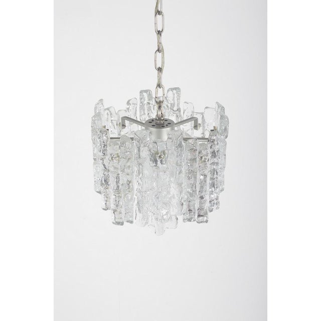 Mid century pendant lamp with glass elements in the shape of ice. This beautiful chandelier was made by the famous brand...