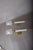 Pair of French 1950s torch-form wall sconces in blue opaline glass and brass. Each torch has a shaft of ribbed opaline...