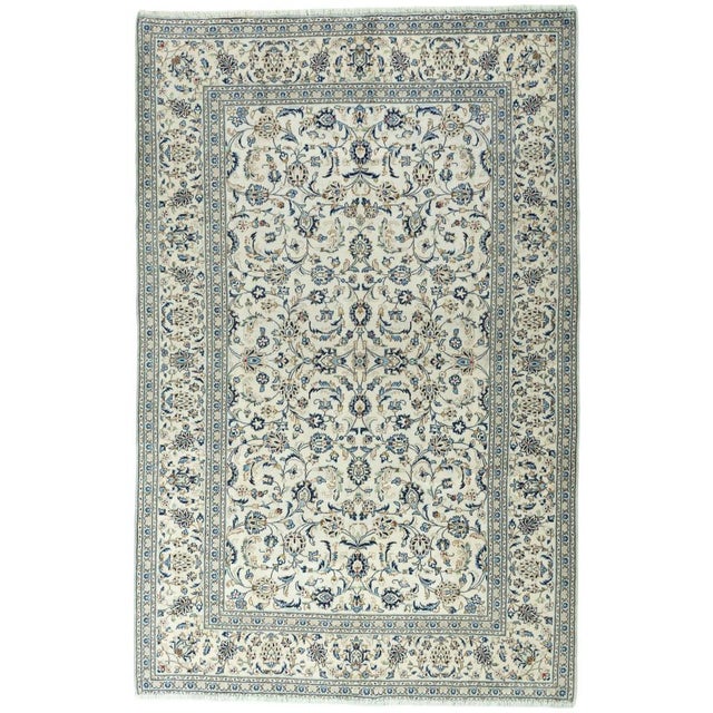This hand-knotted Kashan cork wool rug captivates with its fine knotting, elegant color scheme, and classic all-over...