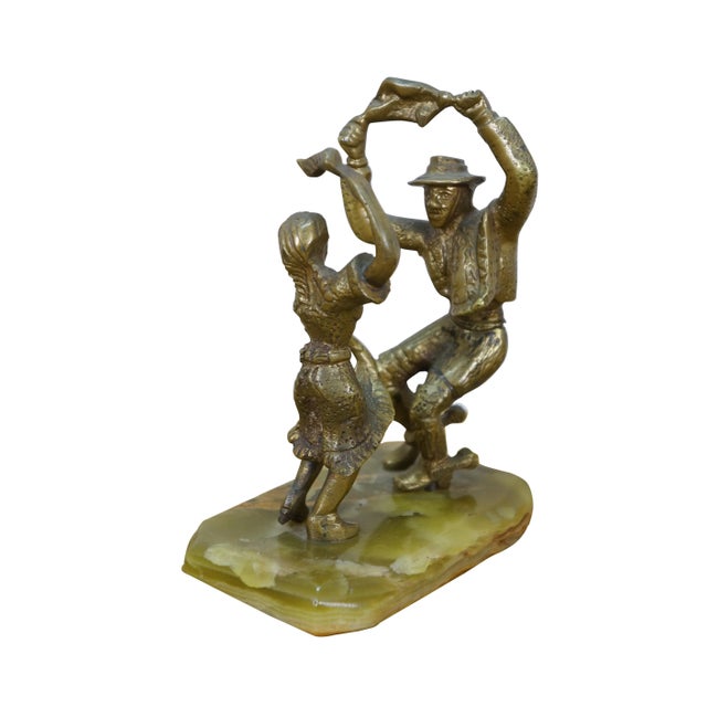 Vintage 20th century figurine / sculpture depicting a pair of cast brass figures in the attitude of a Spanish or South...