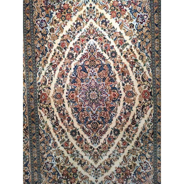 "This semi-antique Persian Nain rug exemplifies the city's tradition of weaving mastery at its most inventive — a piece...
