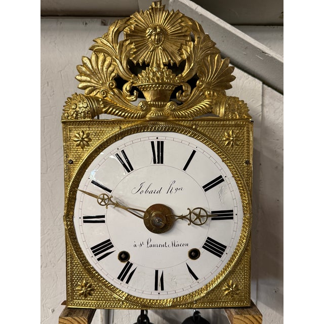 A late 19th century Morbier works for a tall case clock from Jobert Horloger at St Laurent Mâcon with brass embossment of...