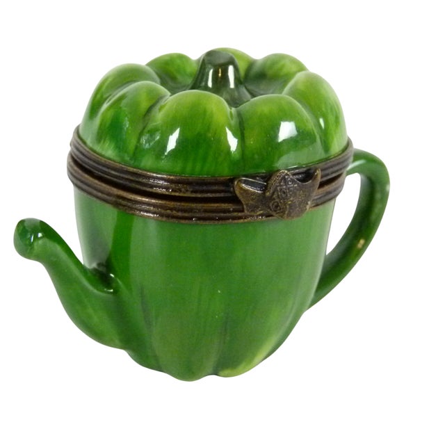 The Teapot opens in the center to display the hand written Hallmark ("Peint main . Limoges France . JD" ) and the two...