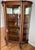 Antique tiger oak China/curio cabinet, dating from the early 1900s, featuring curved (bowed) glass panels (2 side panels,...