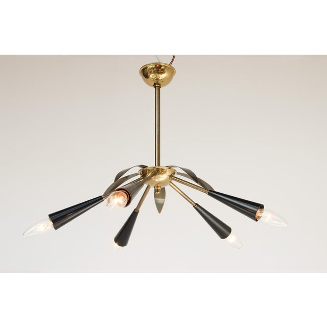 Minimalist pendant lamp, made in Italy in the 1950s. Brass and Bakelite. Very good condition, brass finish with normal...