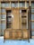 This beautiful walnut hutch with cane accents is the perfect size to display your favorite dinnerware set, and then some....