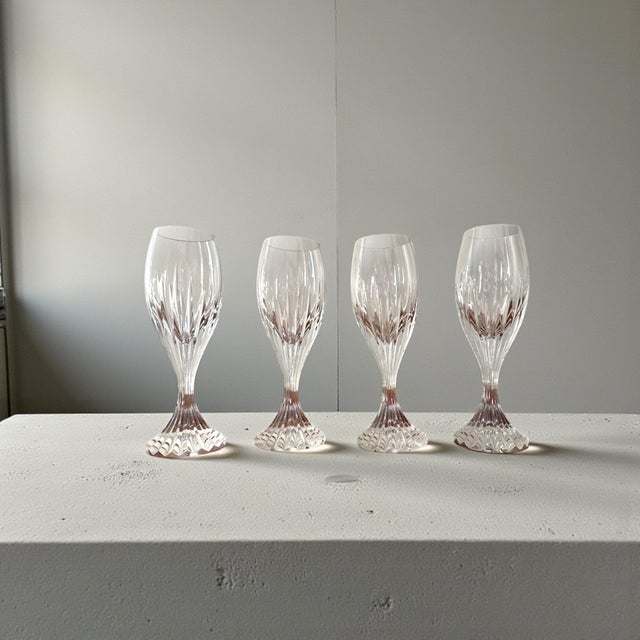 An elegant set of four Baccarat crystal cordial glasses in the classic Masséna pattern, featuring finely cut vertical...