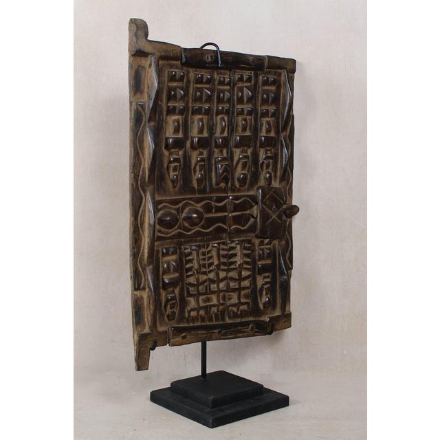 Dogon granary doors originate from the Dogon people of the Bandiagara Escarpment region of Mali. These doors protected the...