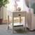 Introduce sophistication and functionality into your living space with the Apis Raffia 1 Drawer 1 Shelf Accent Table in...