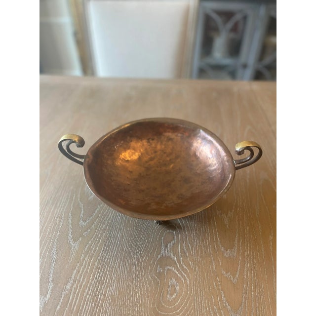 Antique copper and brass dish bowl footed, with 3 legs. Primitive style. Patina all over the bowl. Very nice decorative bowl.