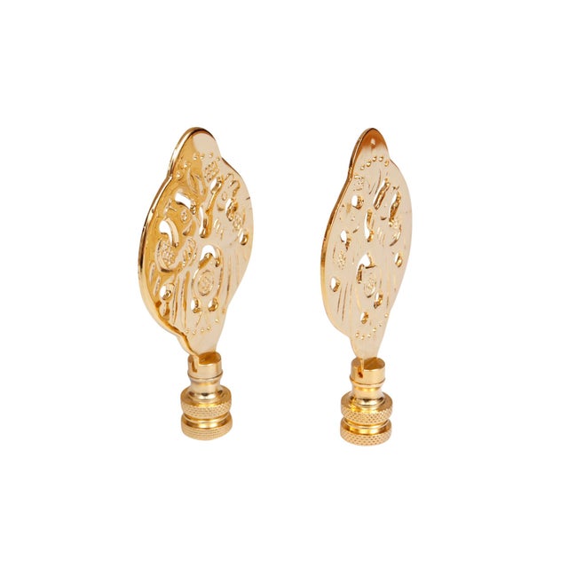 A pair of Chinoiserie style brass lamp finials. Fits a standard size lamp harp. Dimensions per finial. We have more lamp...
