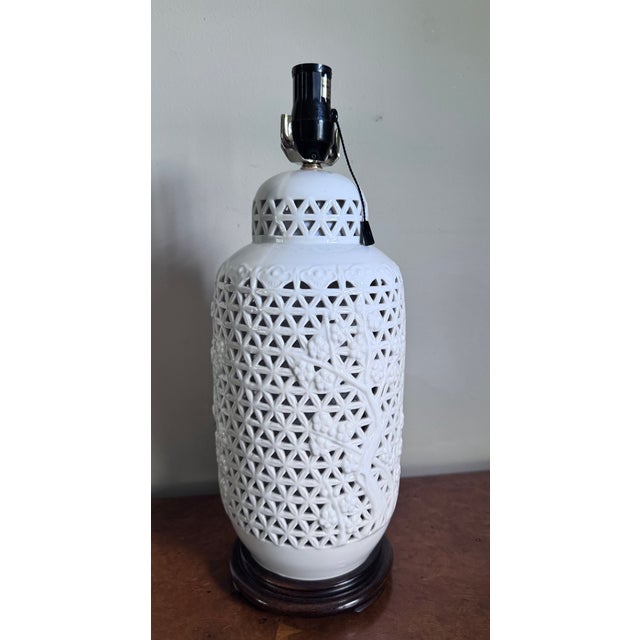 Beautiful mid century Chinese modern pierced Blanc de Chine lamp. Lovely cherry tree motif that adds both a traditional...
