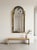 Queen Anne style pier mirror featuring verre églomisé (reverse-painted and gilded glass panels) with intricate scrollwork,...