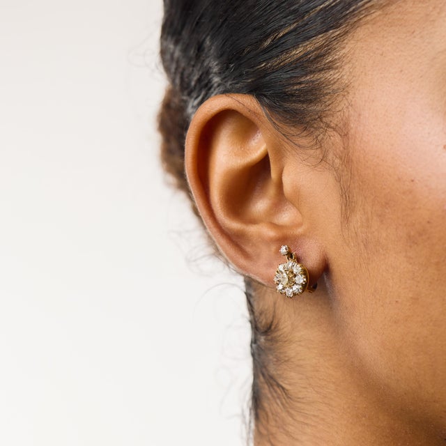 These charming Victorian cluster earrings showcase a beautiful arrangement of 20 old mine cut diamonds totaling...