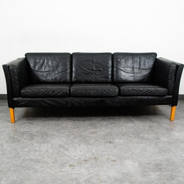 High quality early black leather Danish modern 3 seater sofa / couch. This piece was imported directly from Denmark in our...