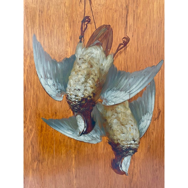The product is an antique still life painting of game, birds or ducks after the hunt by artist Clarence E. Braley, from...