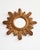 A highly decorative, gilded sunburst mirror from the 1950s, in very good condition. Elegant, intricately carved frame...
