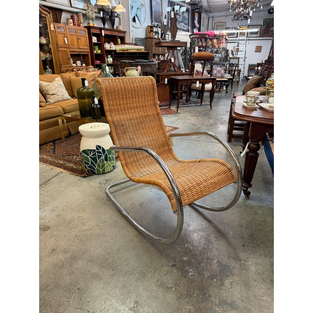 An exceptional mid-century modern rocking chair heavily inspired by the iconic tubular steel designs of master modernist...