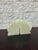 Pair of carved green onyx bookends with a stepped geometric design and softly translucent stone. Natural variation...