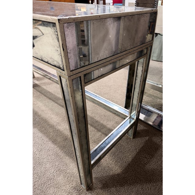 Elevate your space with the refined glamour of this John-Richard églomisé mirrored vanity table, a stunning blend of...