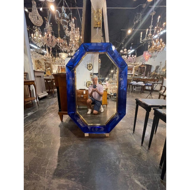 Exceptional modern heavy cobalt blue Murano glass and brass octagonal mirror. The color and depth of this glass is...
