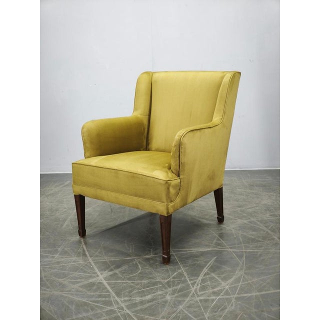 Designed by the celebrated Danish cabinetmaker Frits Henningsen, this elegant armchair is an outstanding example of...