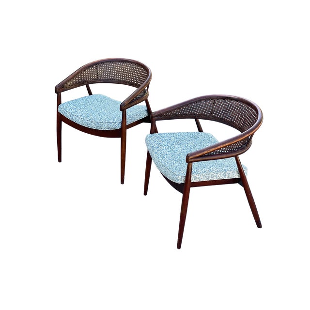 This is a wonderful pair of vintage 1950's James Mont "King Cole" armchairs. Each chair has a dark wood frame with cane...