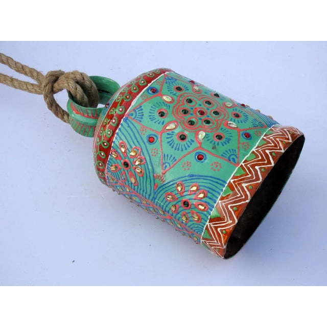 The bell is made of iron and coated primarily with copper, along with a few other metals. They are made from scrap iron...