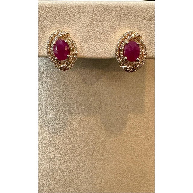 Experience the beauty and elegance of these stunning stud earrings, featuring a captivating combination of a 3.5 carat...